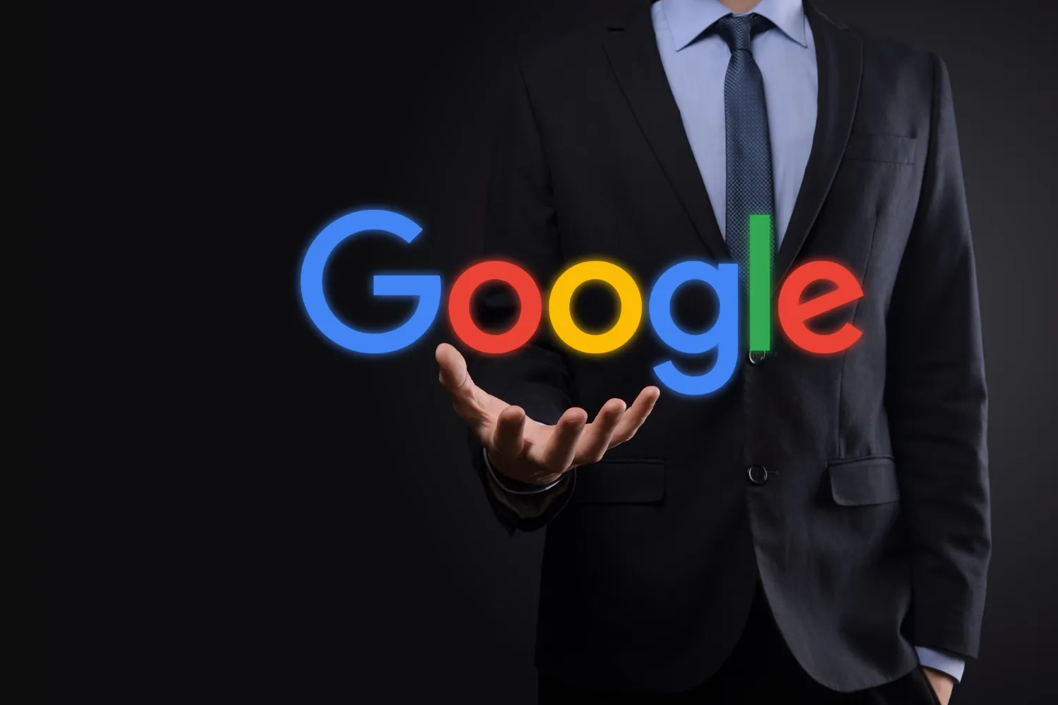 businessman-suit-holds-google-logo